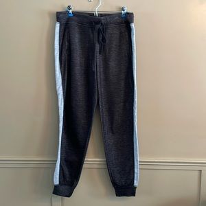 Dark charcoal gray with light gray side stripes sweatpants. Size medium